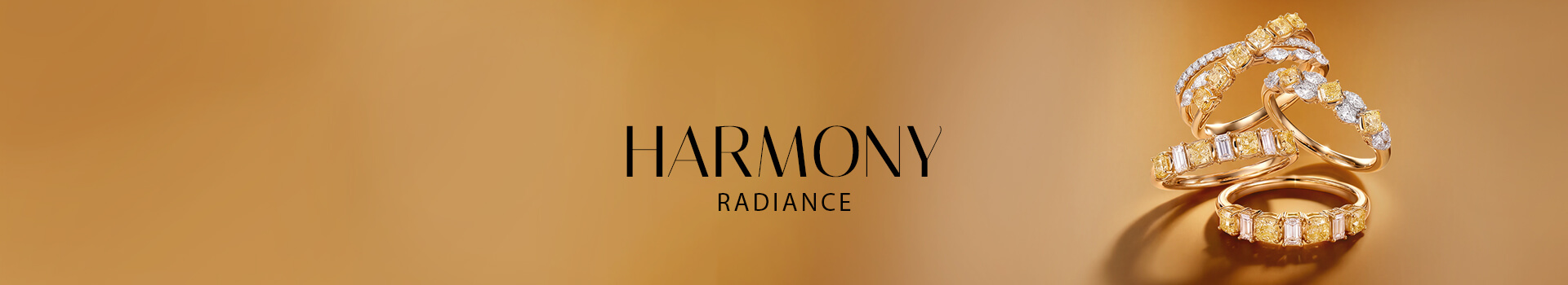 Le Vian® yellow diamond rings with white diamond accents on a warm golden background.